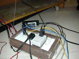 raw wires inserted in electrical outlet